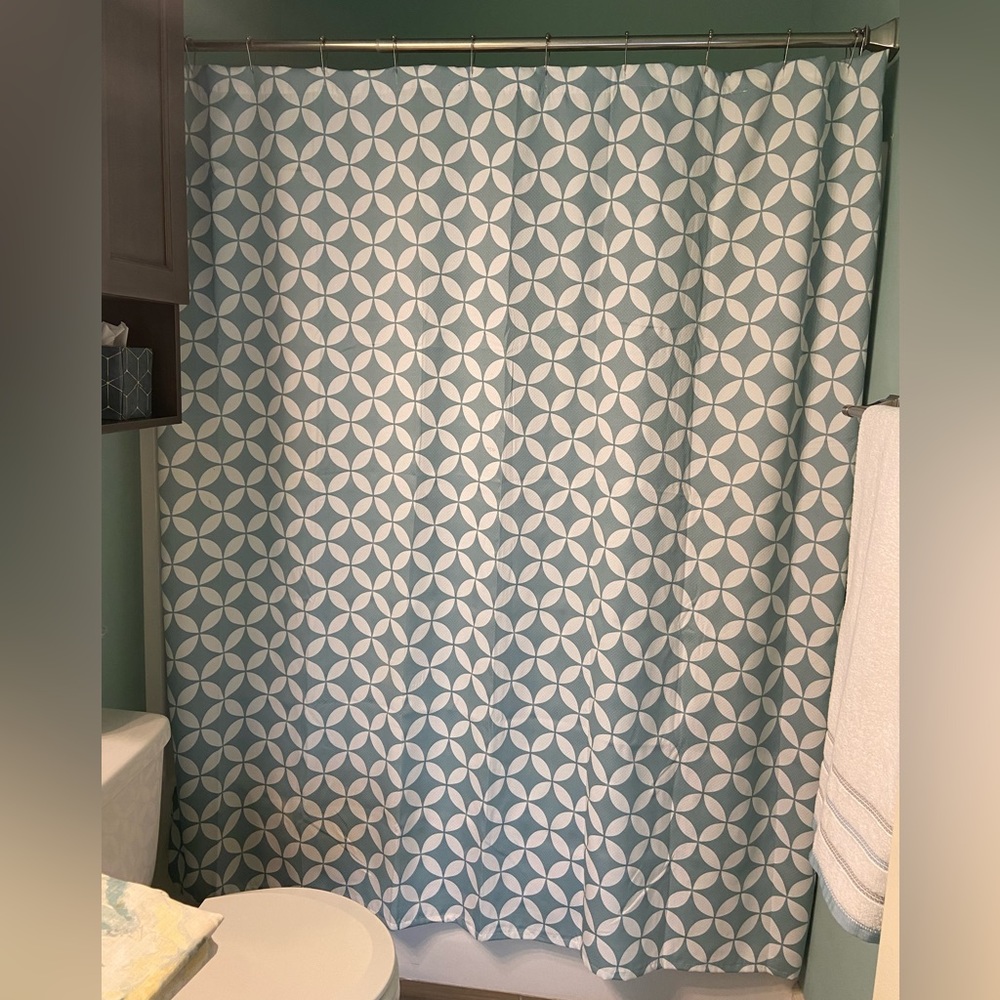 Spa blue and white geometric fabric shower curtain.